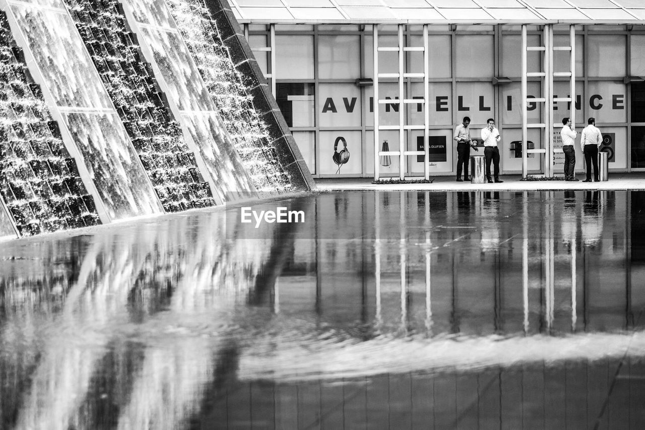 PEOPLE SWIMMING POOL IN CITY