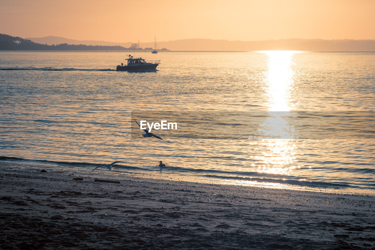 Scenic view of sea against sky during sunset