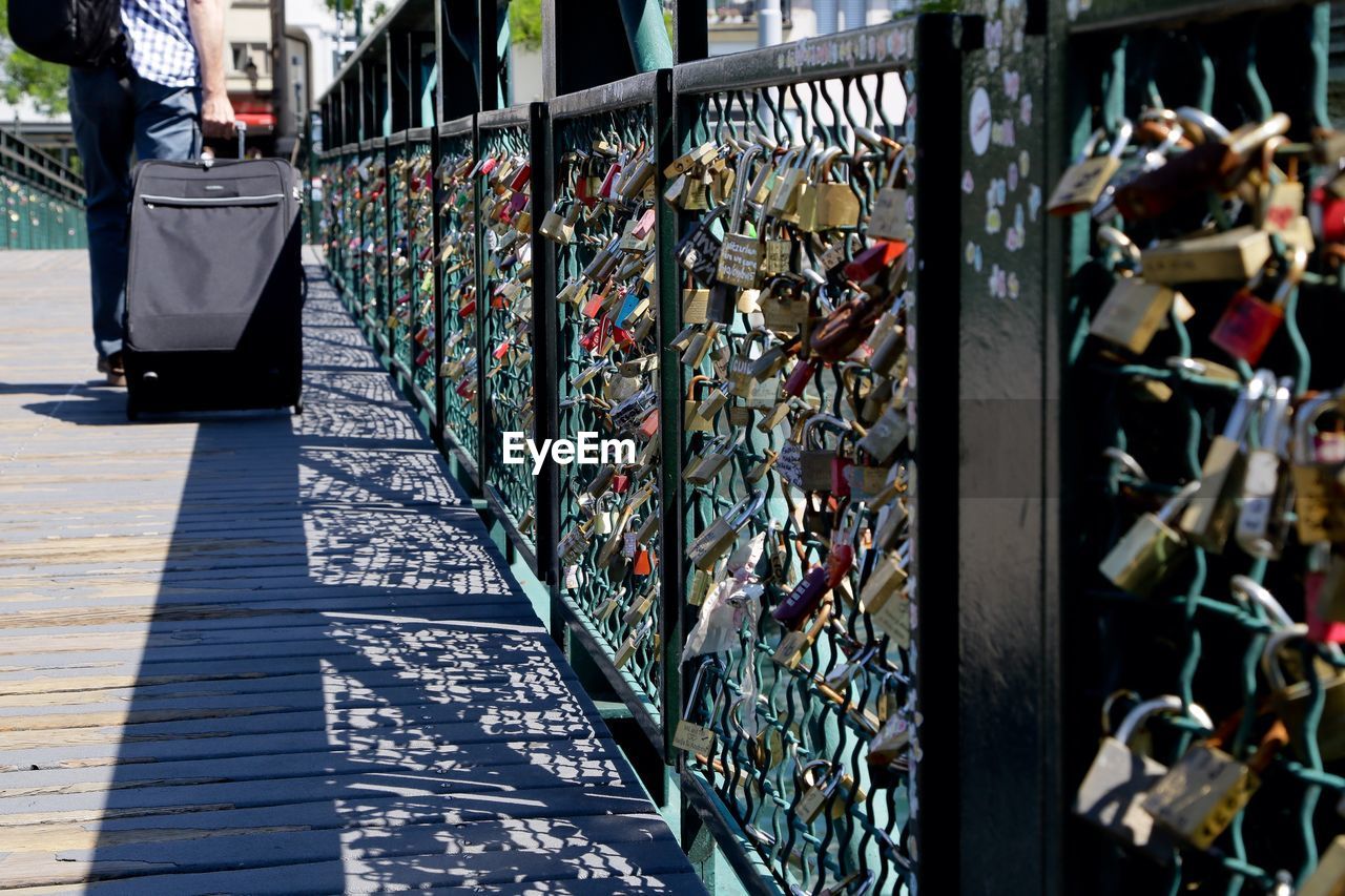 Close-up of padlocks on railing at pont des arts