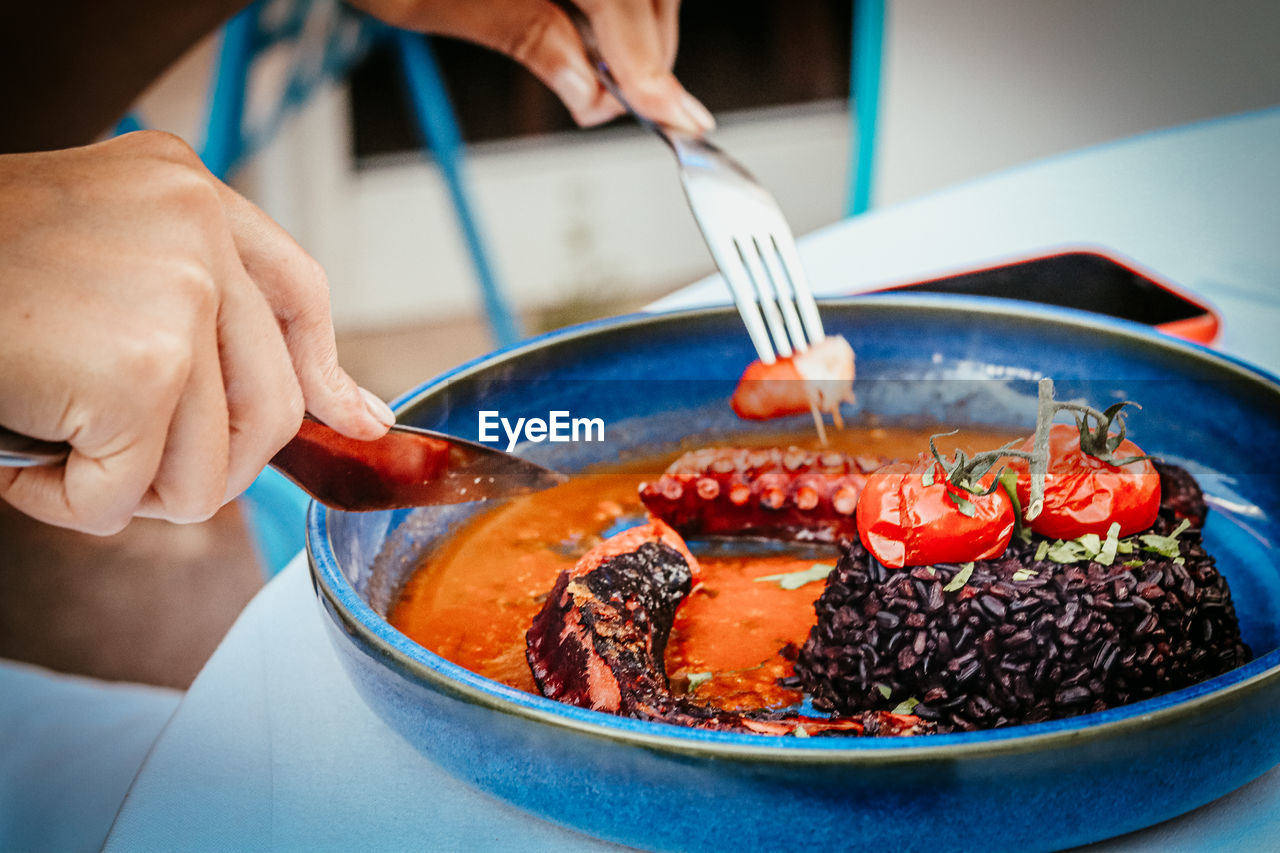 Midsection of man preparing food