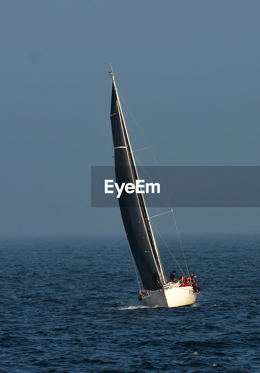 Sailboat sailing in sea