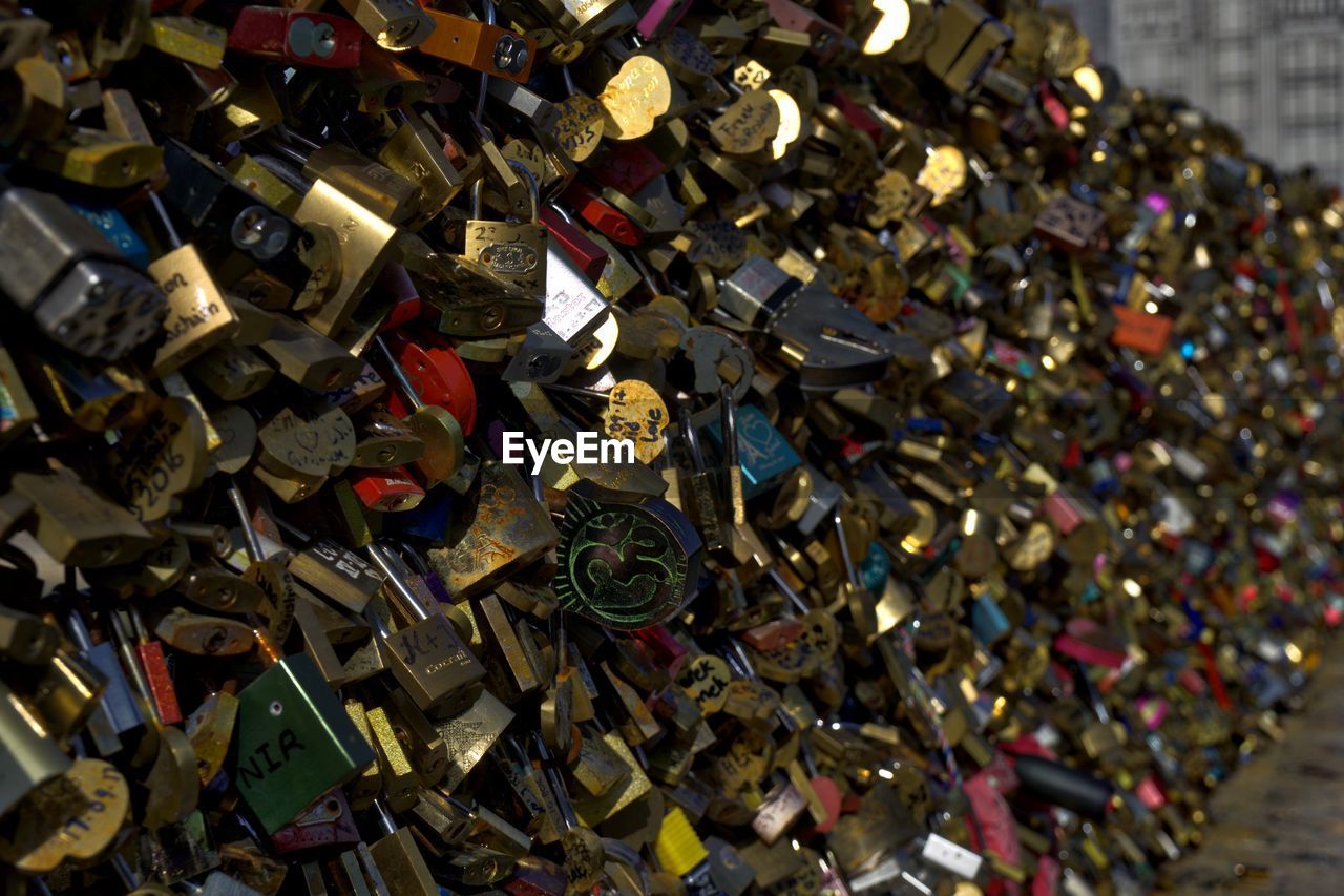 CLOSE-UP OF PADLOCKS ON BRIDGE