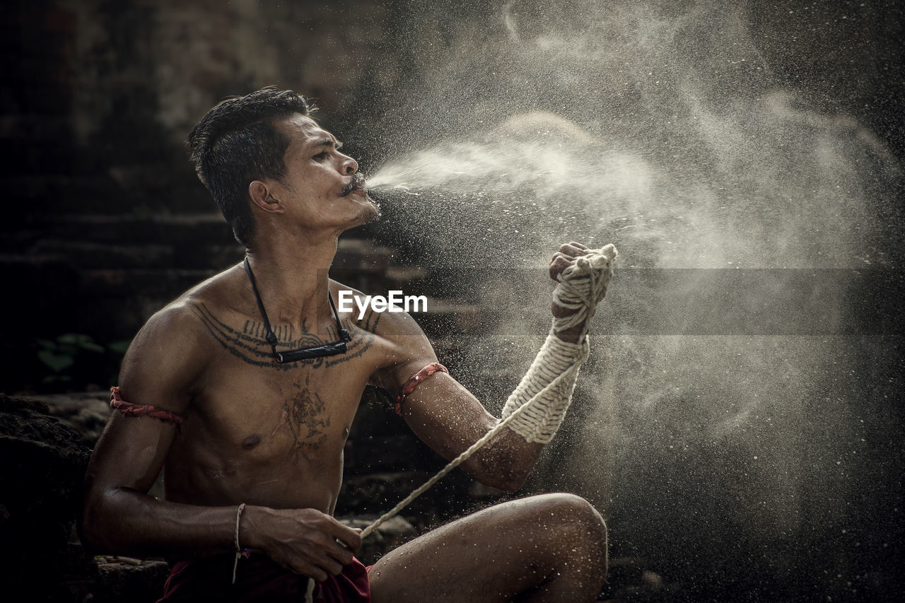 Man spraying water on hand