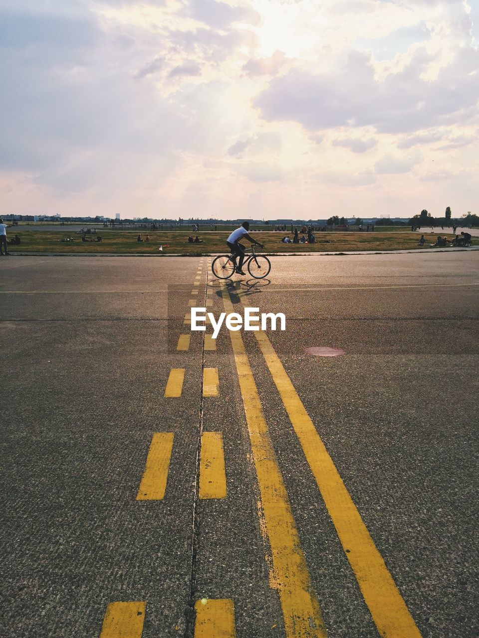 Man riding bicycle on road