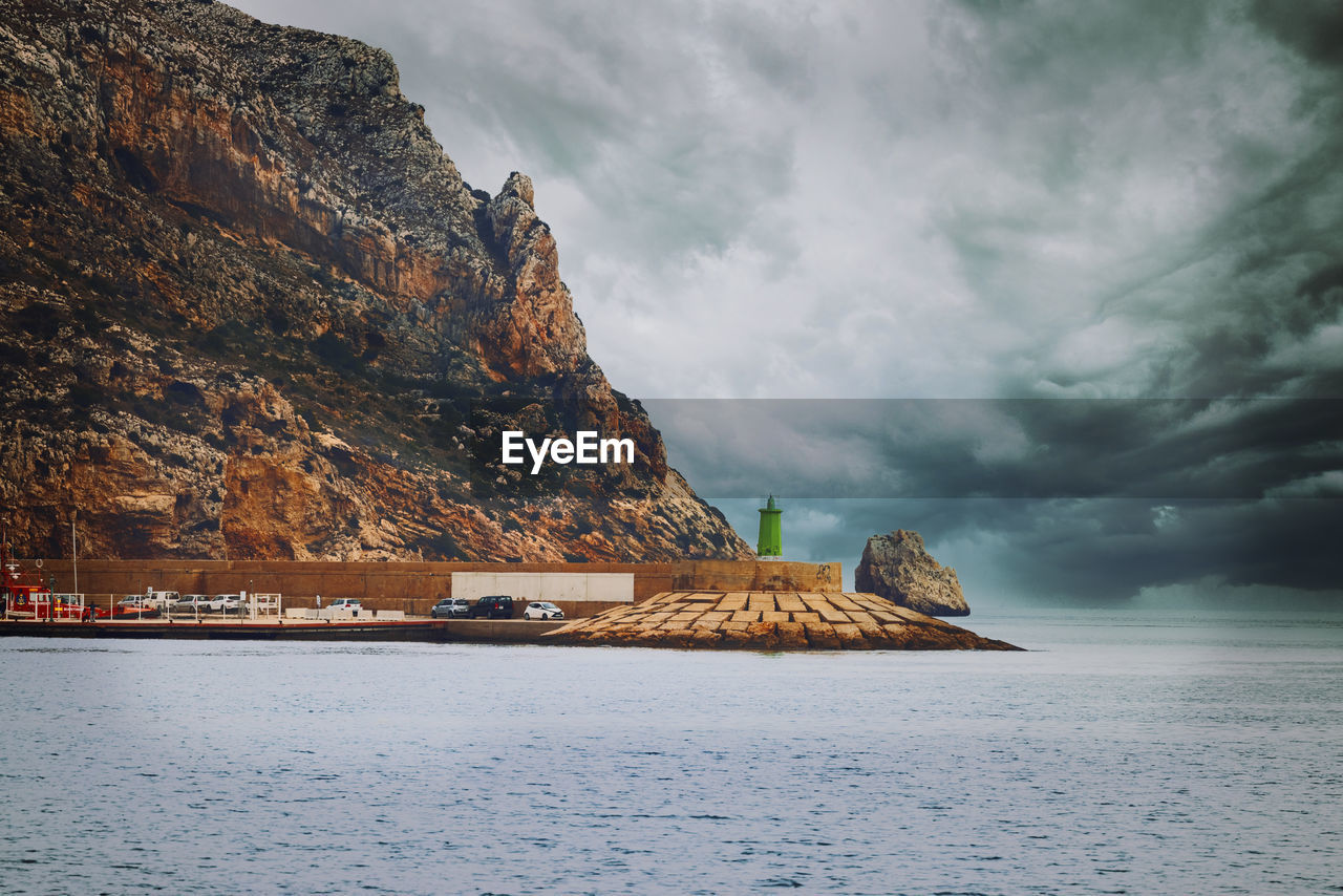 Scenic view of sea against cloudy sky