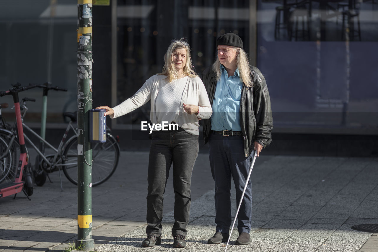 Senior couple standing at crosswalk