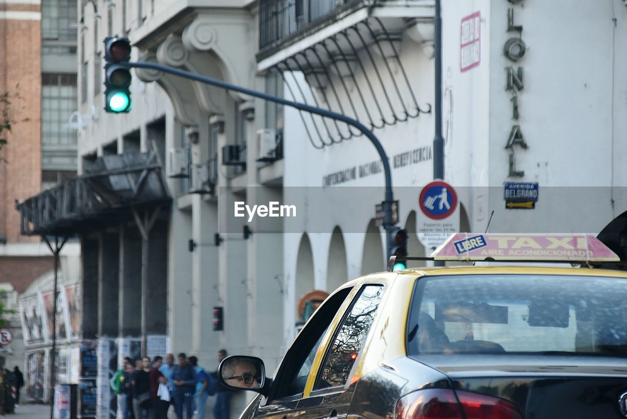 Close-up of cars on street