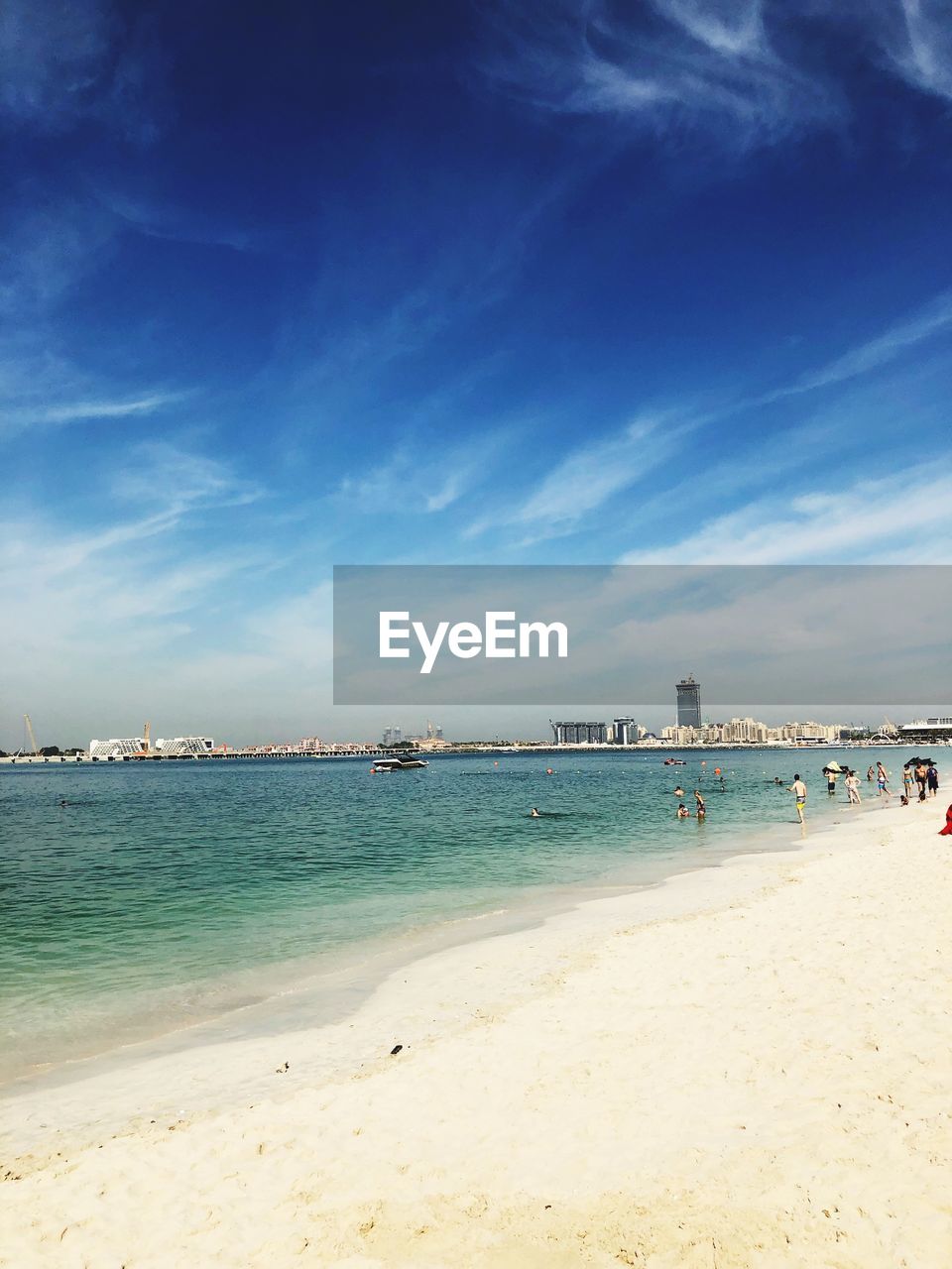 Scenic view of beach against blue sky