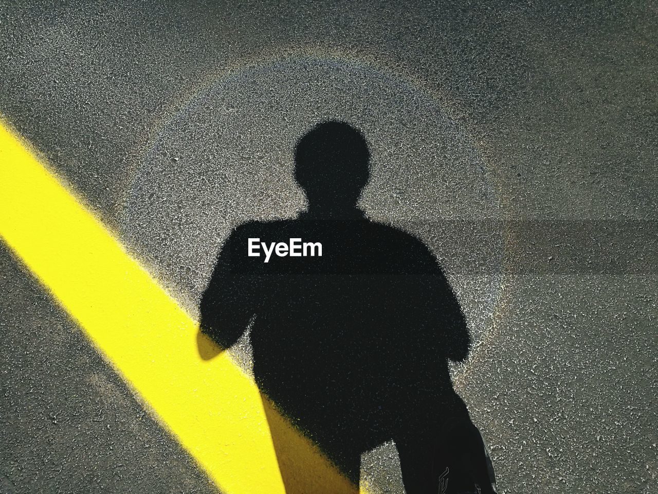 High angle view of man standing on street