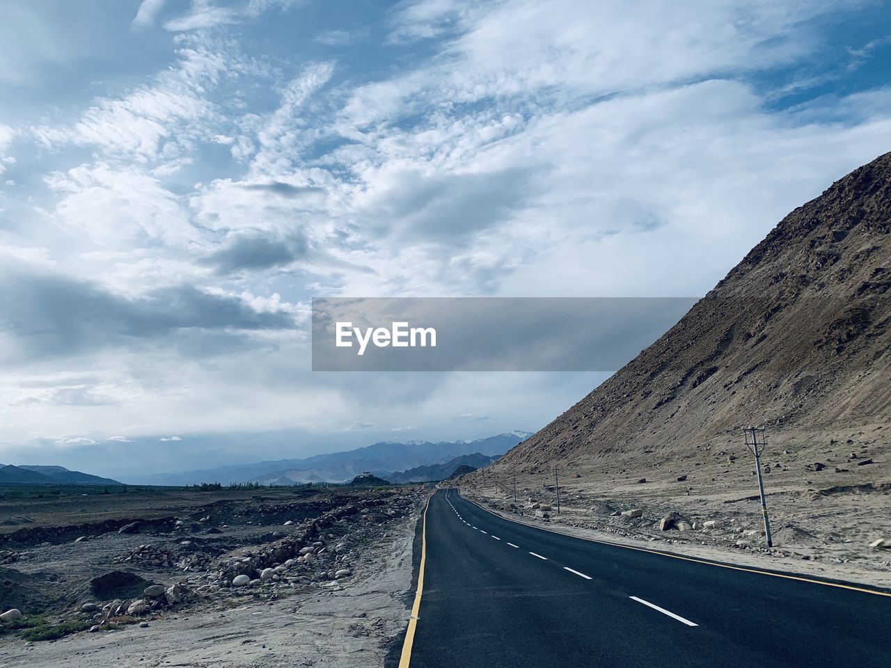 Empty road against sky