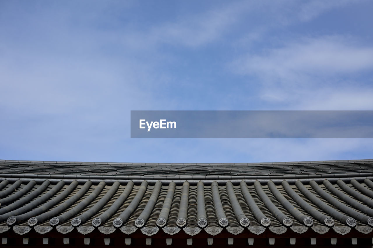 sky, cloud, architecture, roof, no people, built structure, blue, nature, day, horizon, roof tile, pattern, outdoors, copy space, in a row, building exterior, line, low angle view, sunlight