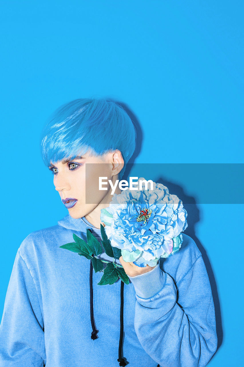 Girl with short blue colored hair. trendy haircut concept