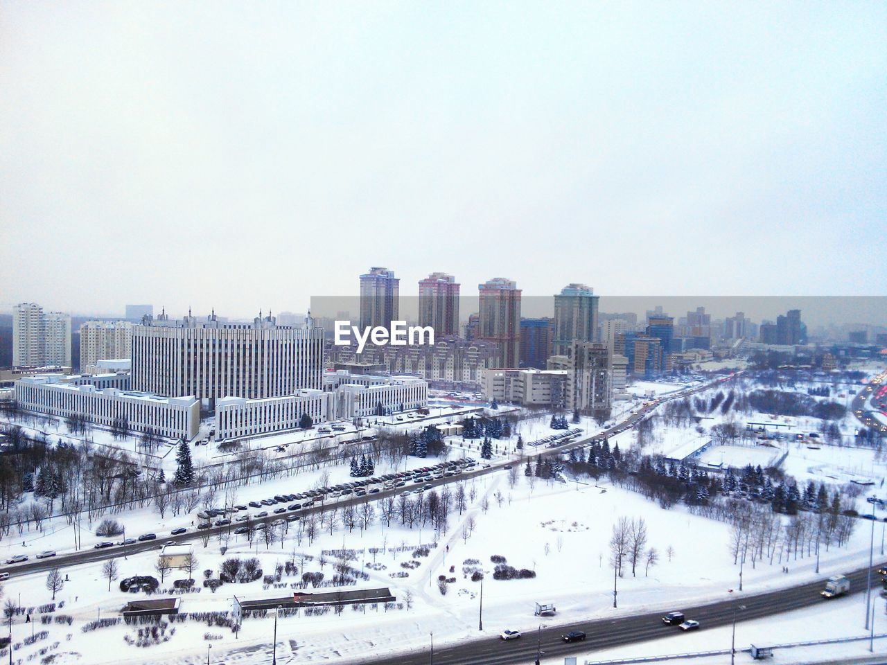 View of cityscape against sky during winter