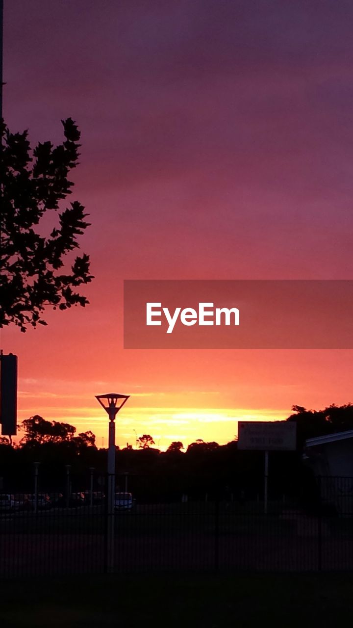 Street light against during sunset