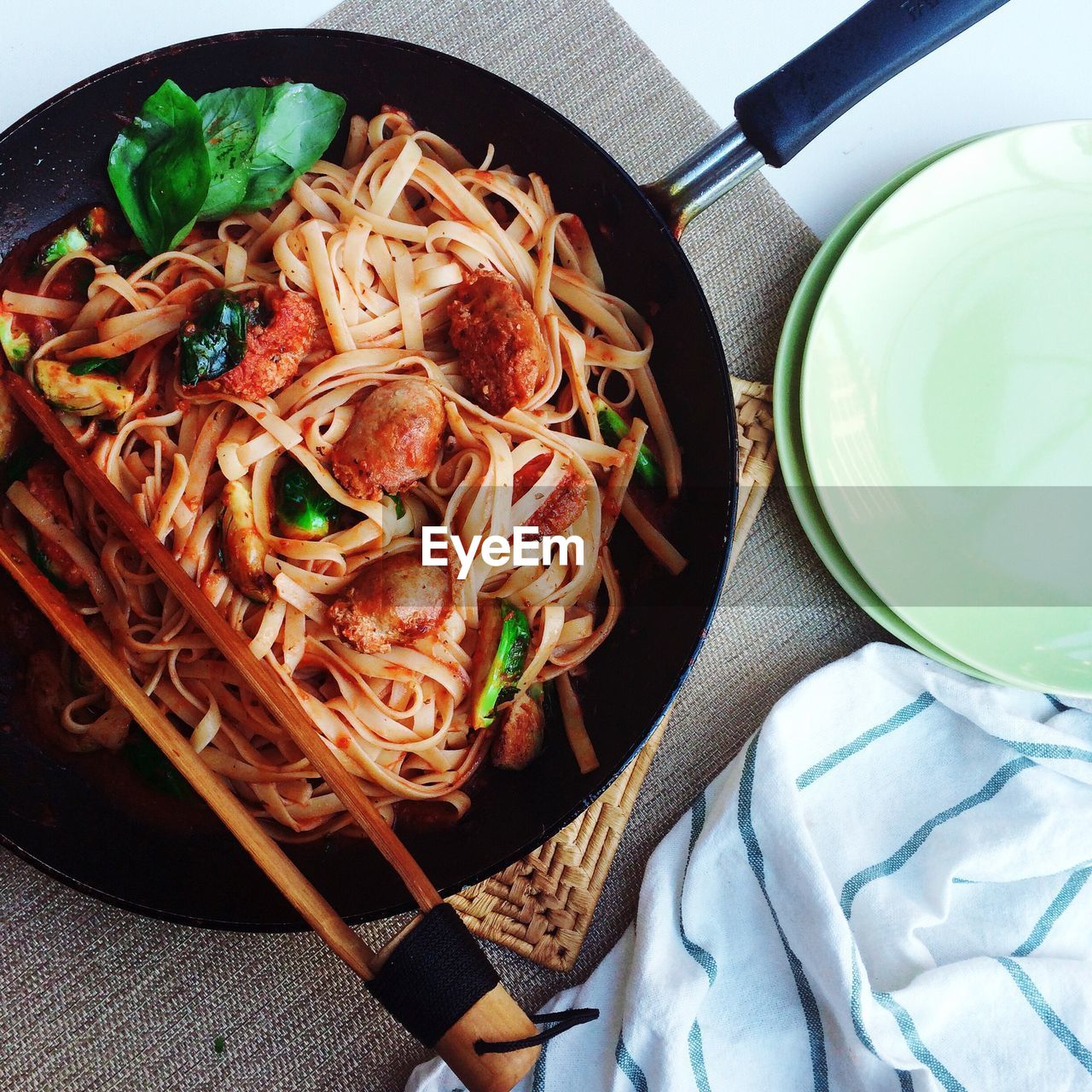 Directly above shot of tomato pasta in pan on table