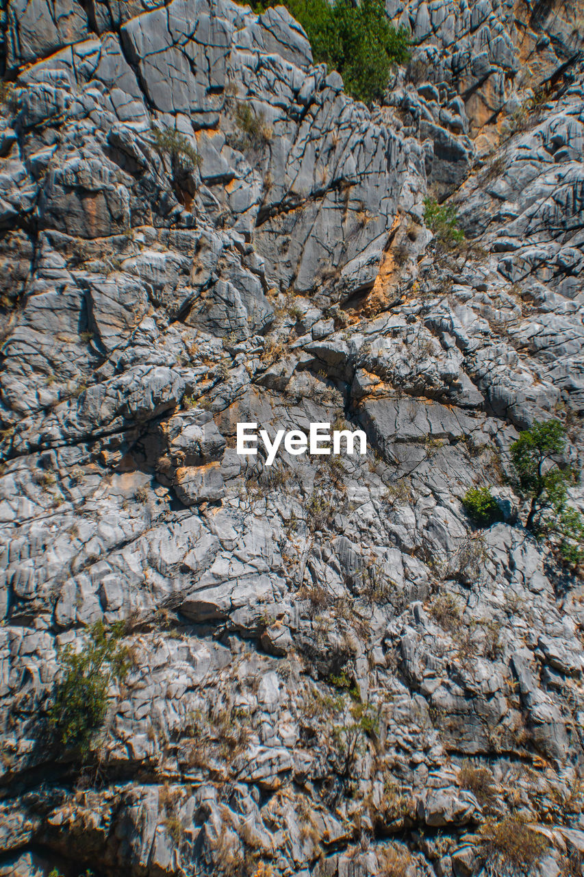 LOW ANGLE VIEW OF ROCK FORMATIONS