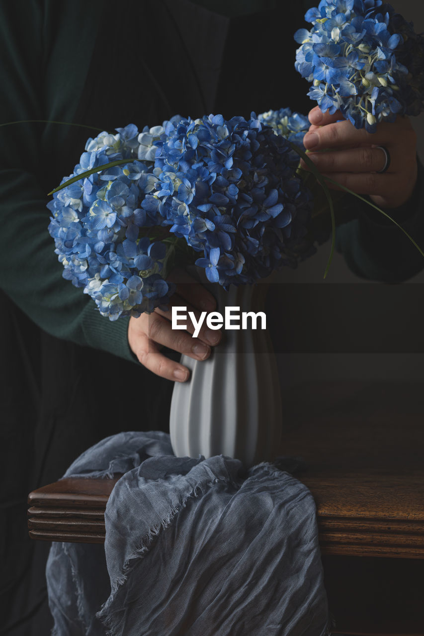 Close-up of person holding bouquet