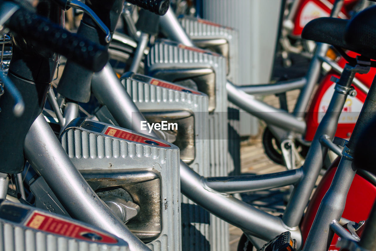 CLOSE-UP OF BICYCLE PARKED ON METAL