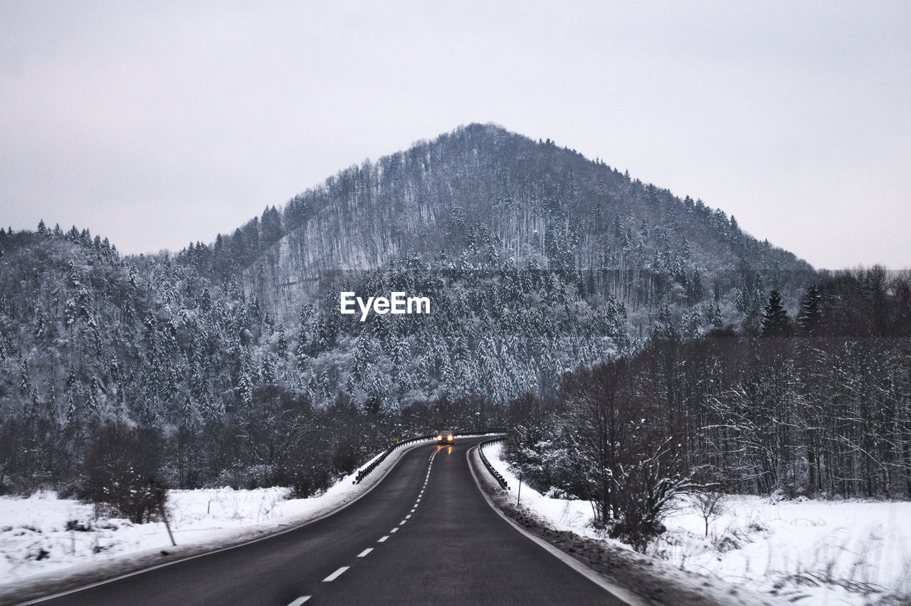 Snow covered mountain against sky