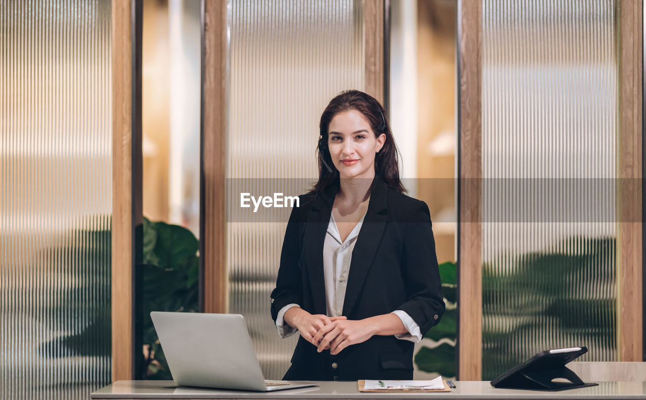 Smile receptionist welcome at hotel front desk