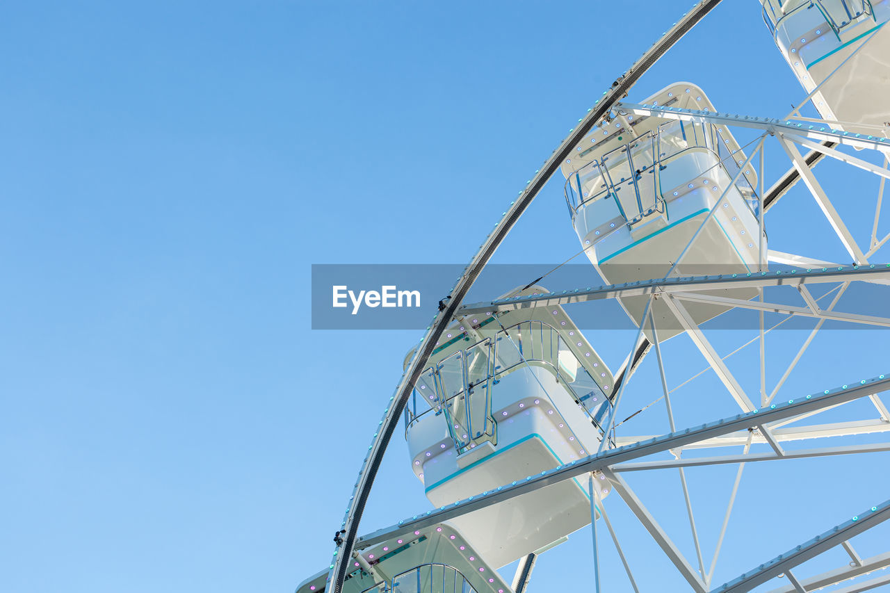 low angle view of spiral staircase against clear blue sky