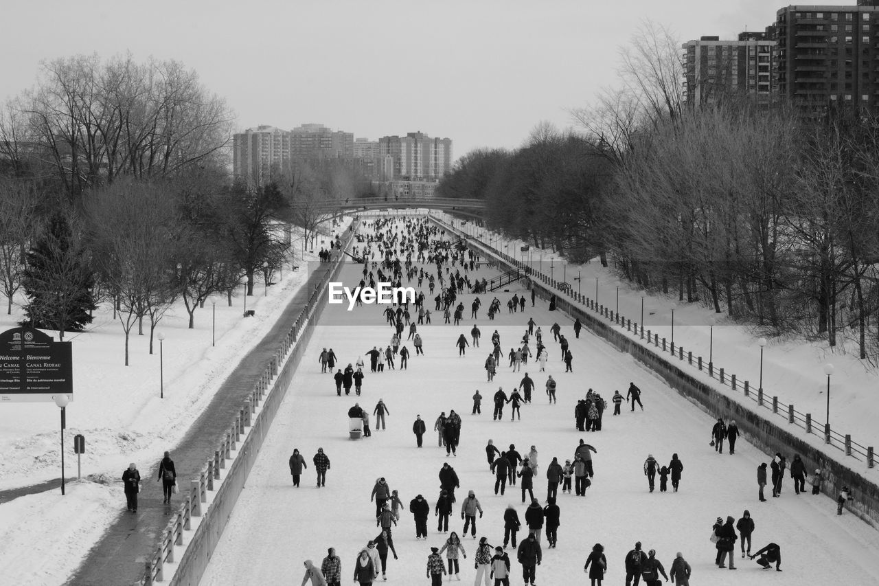 People walking on snow covered ground