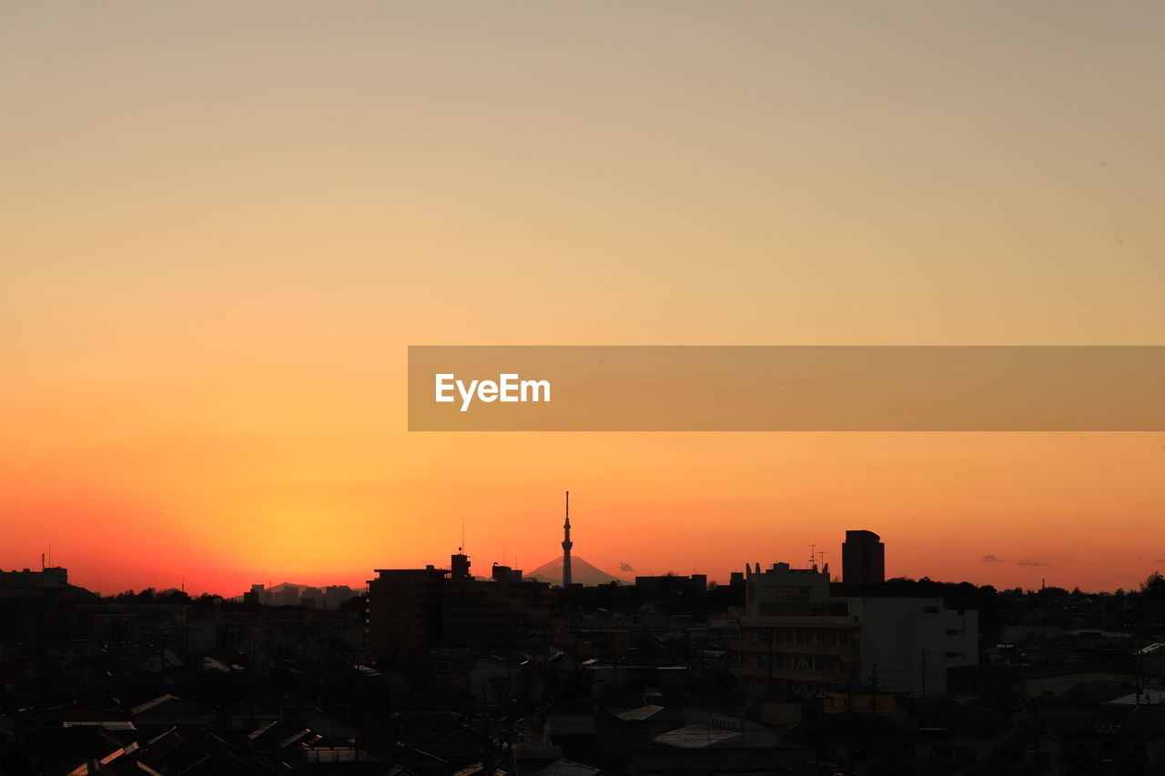 SILHOUETTE OF BUILDINGS AT SUNSET