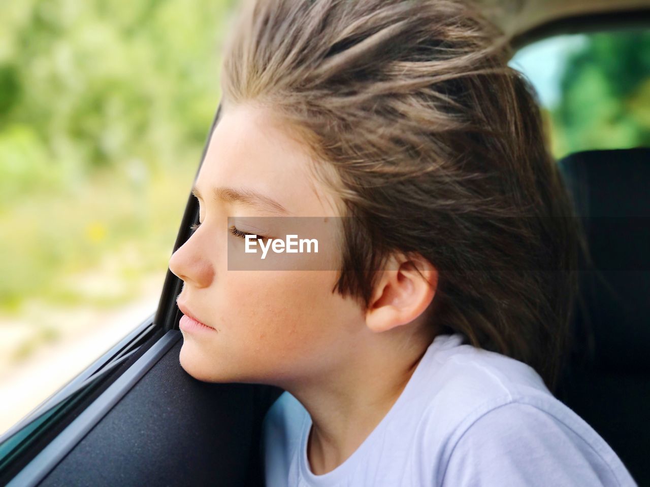 Close-up of boy in car