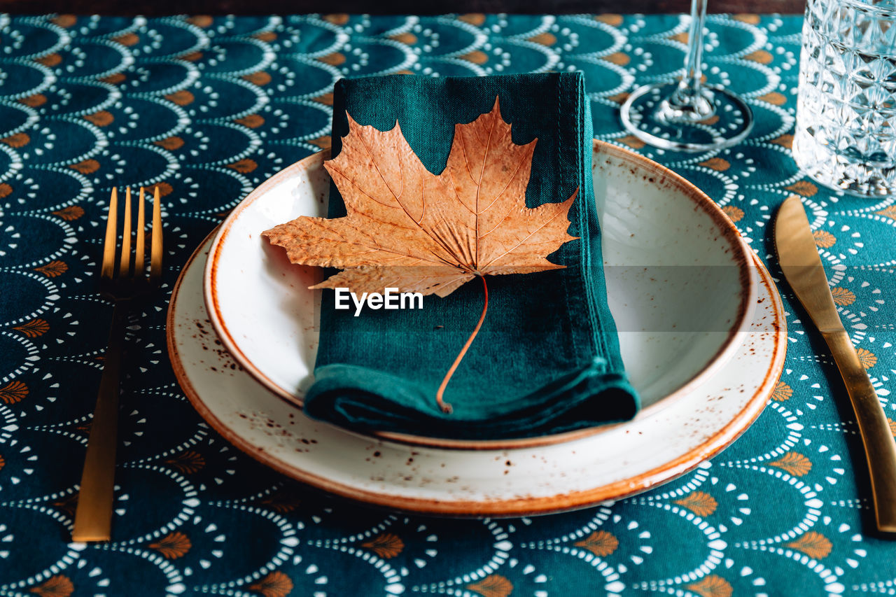 High angle view of dry leaves on table