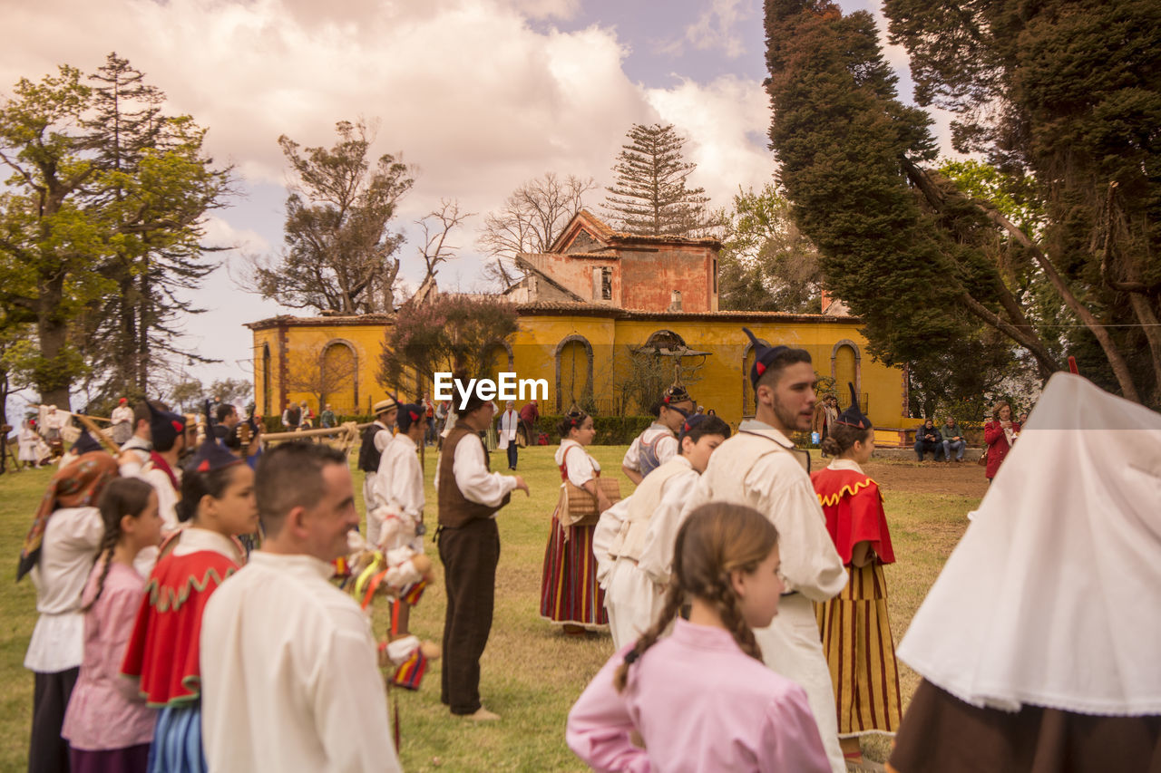 GROUP OF PEOPLE IN TRADITIONAL CLOTHING