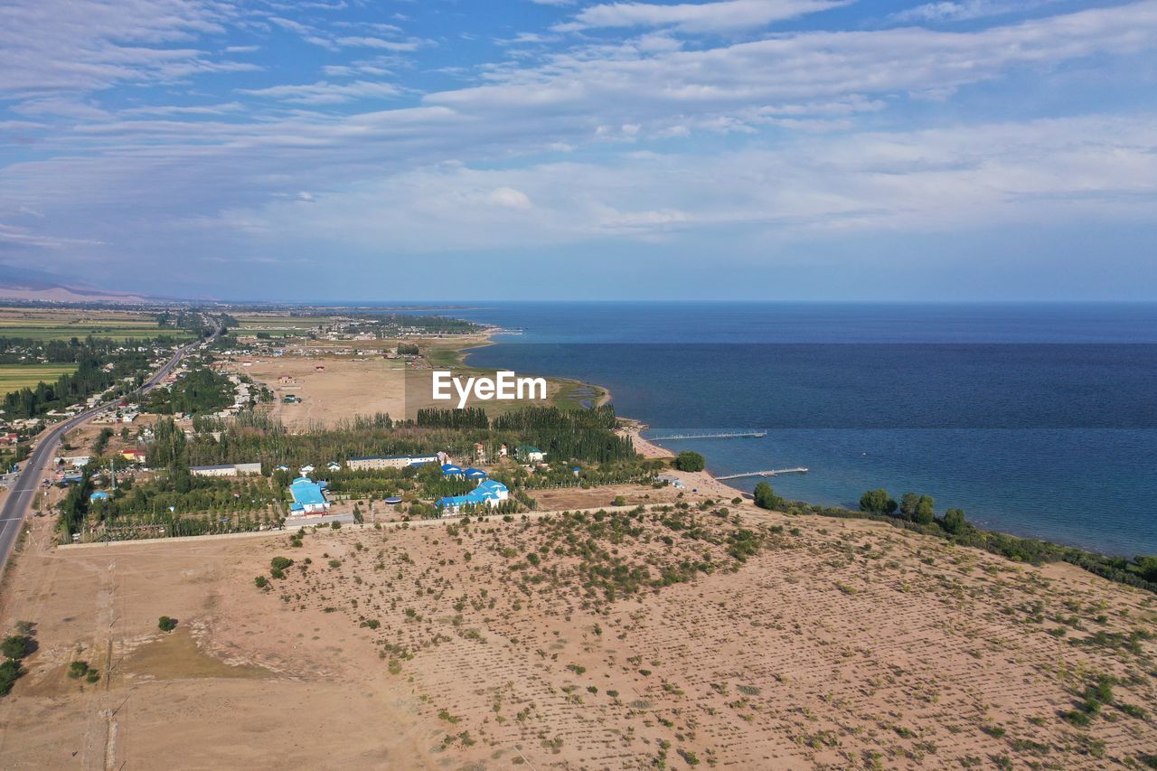 PANORAMIC VIEW OF BEACH AGAINST SKY