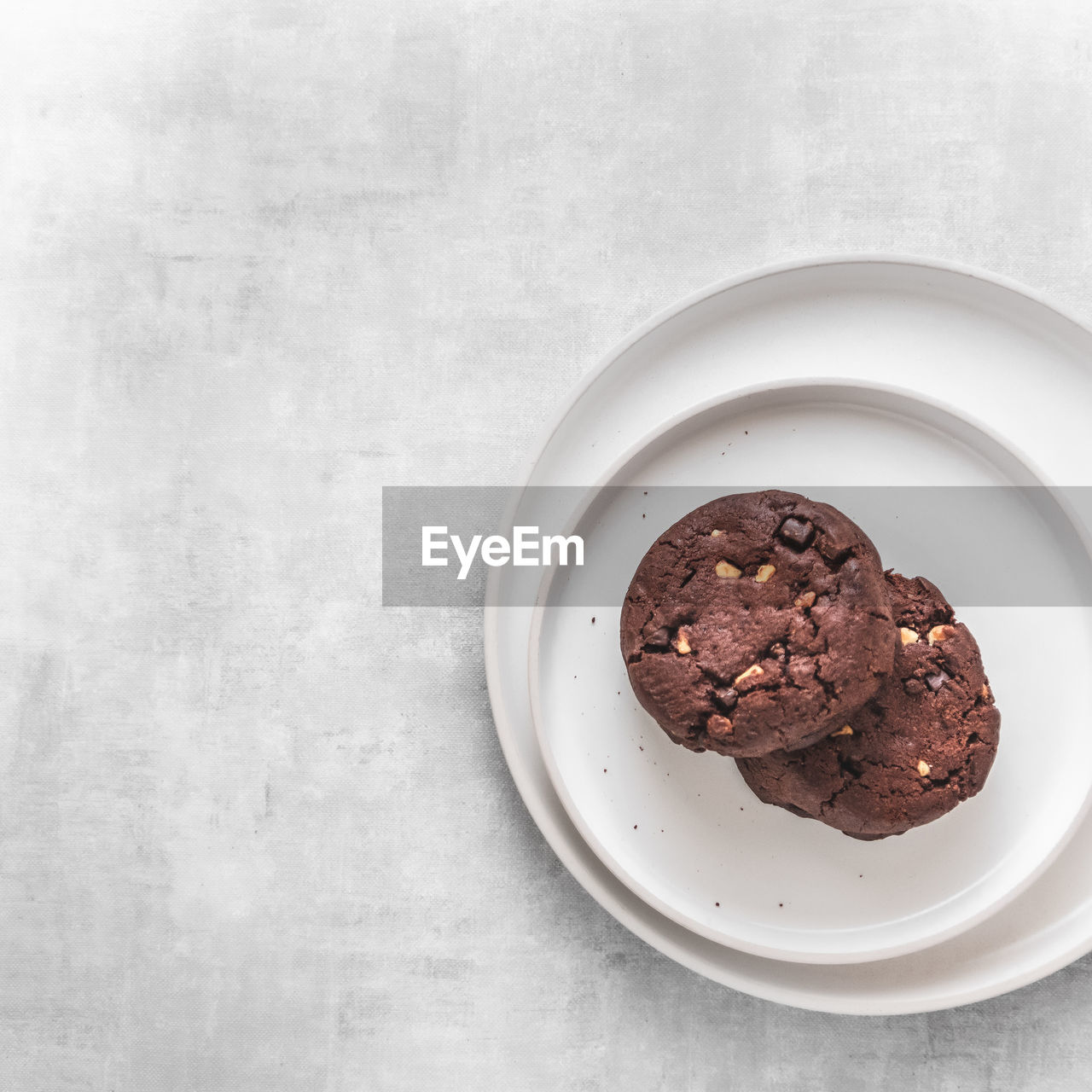 Directly above shot of chocolate cookies in plate on table