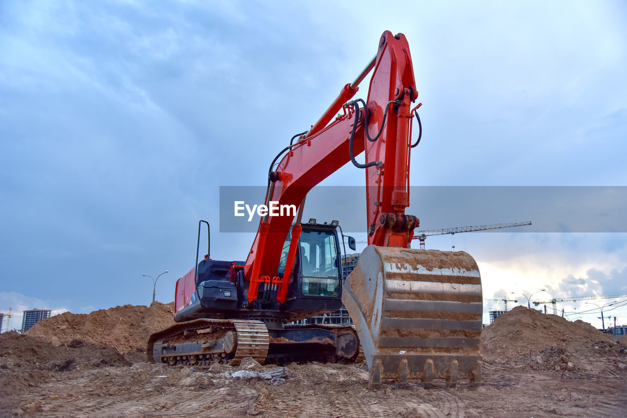 Excavator on eartwork working at construction site.