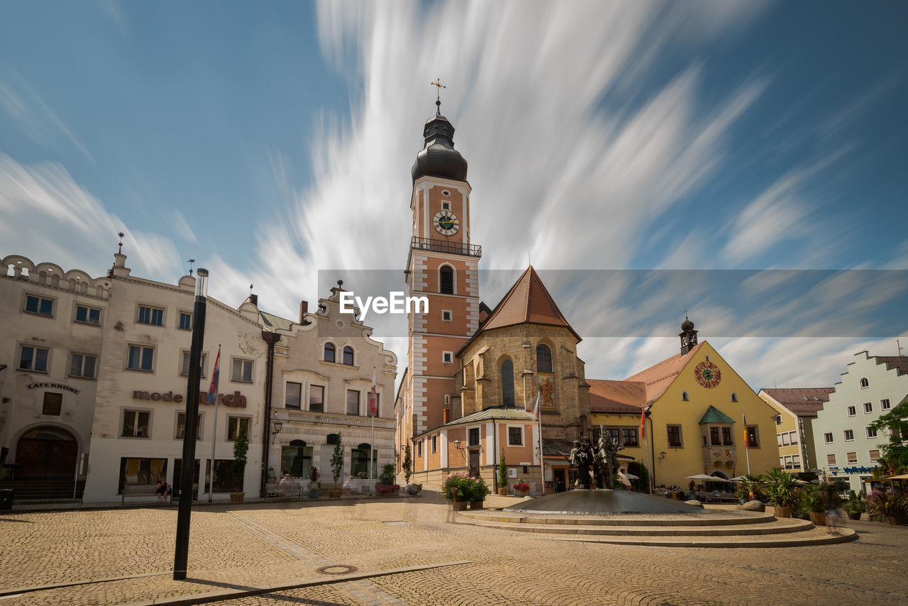 BUILDINGS IN CITY AGAINST SKY