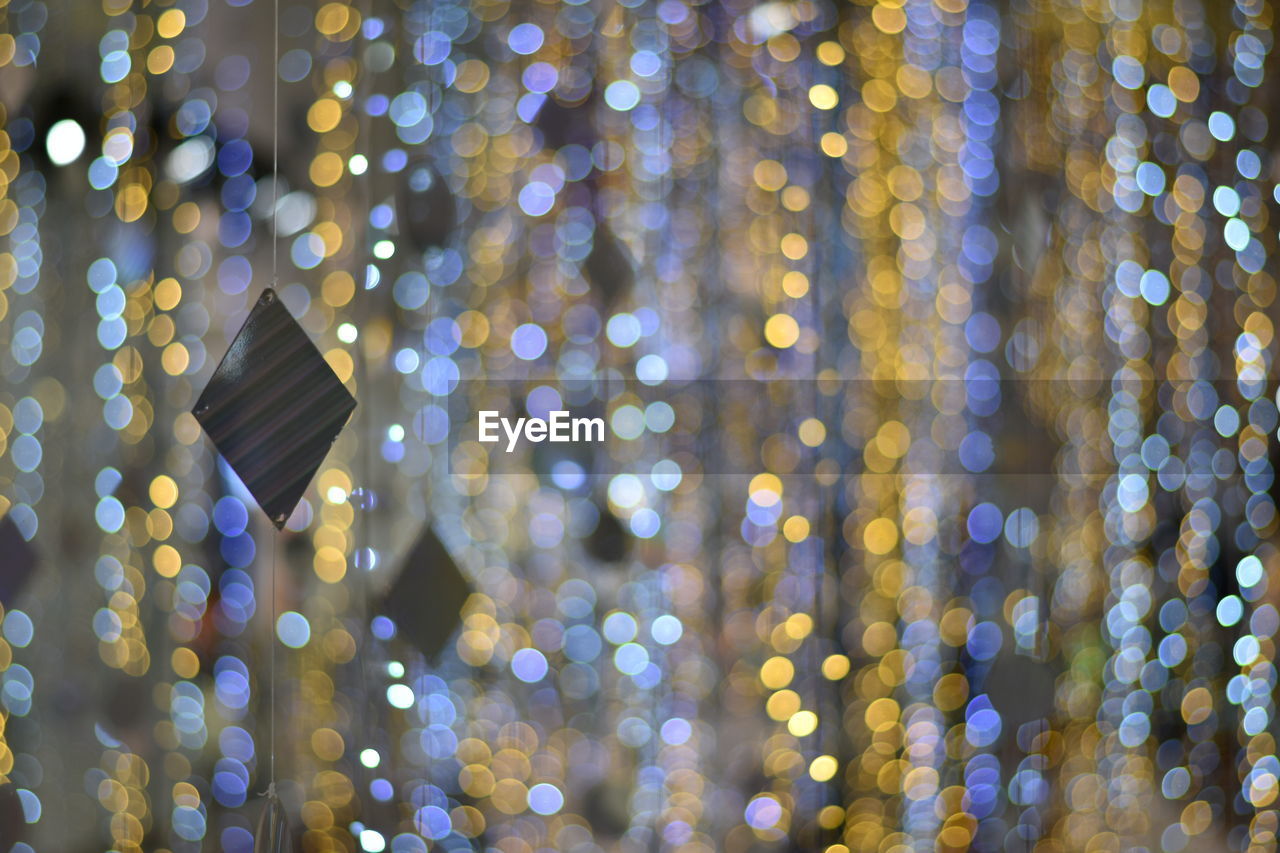 Defocused image of illuminated lights at night