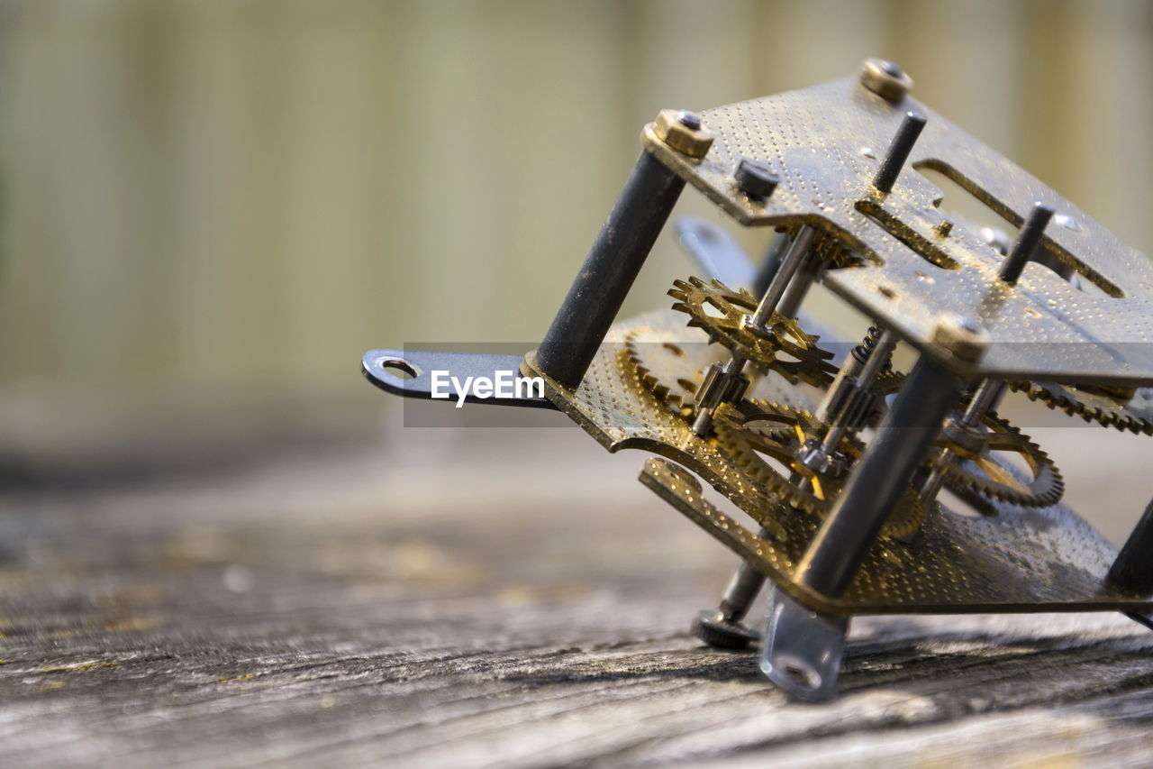 Close-up of machine part on table