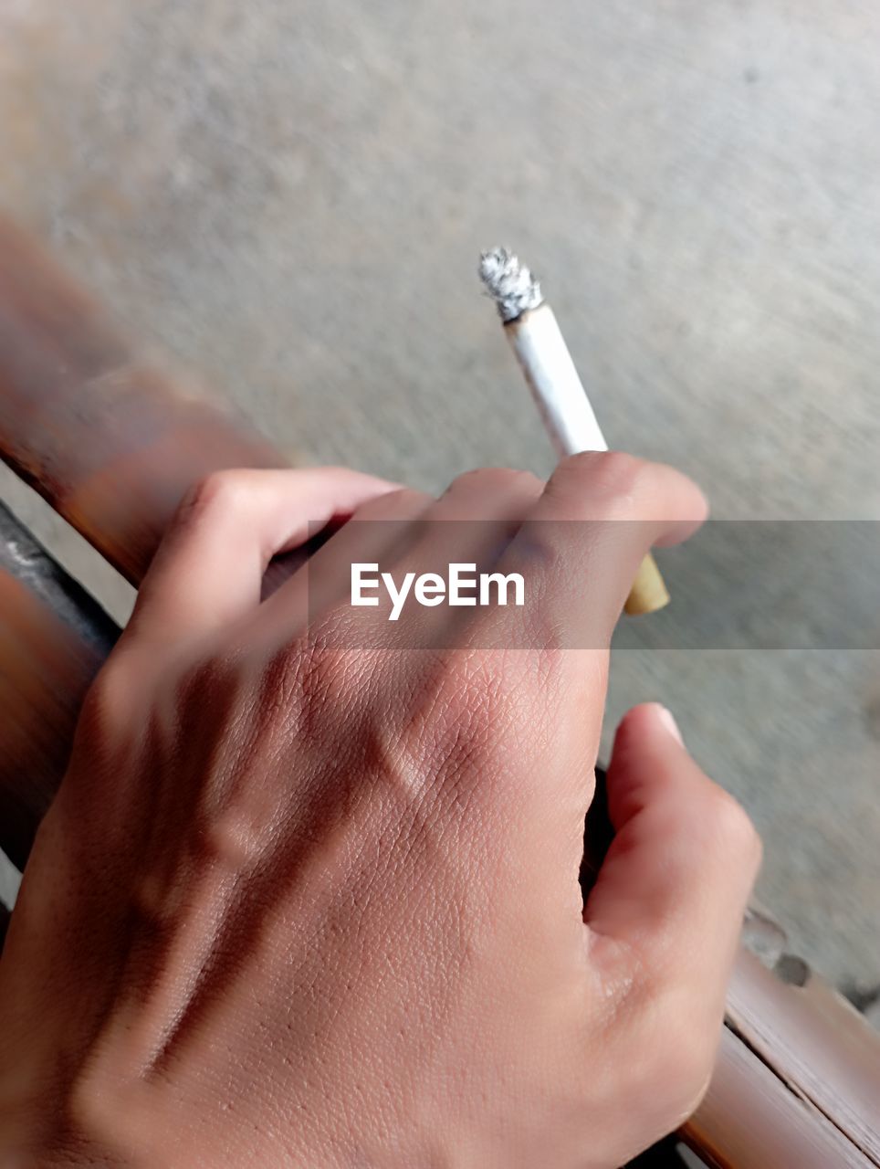 cropped hand of man working on table