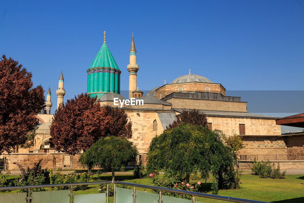 Panoramic view of mosque against blue sky