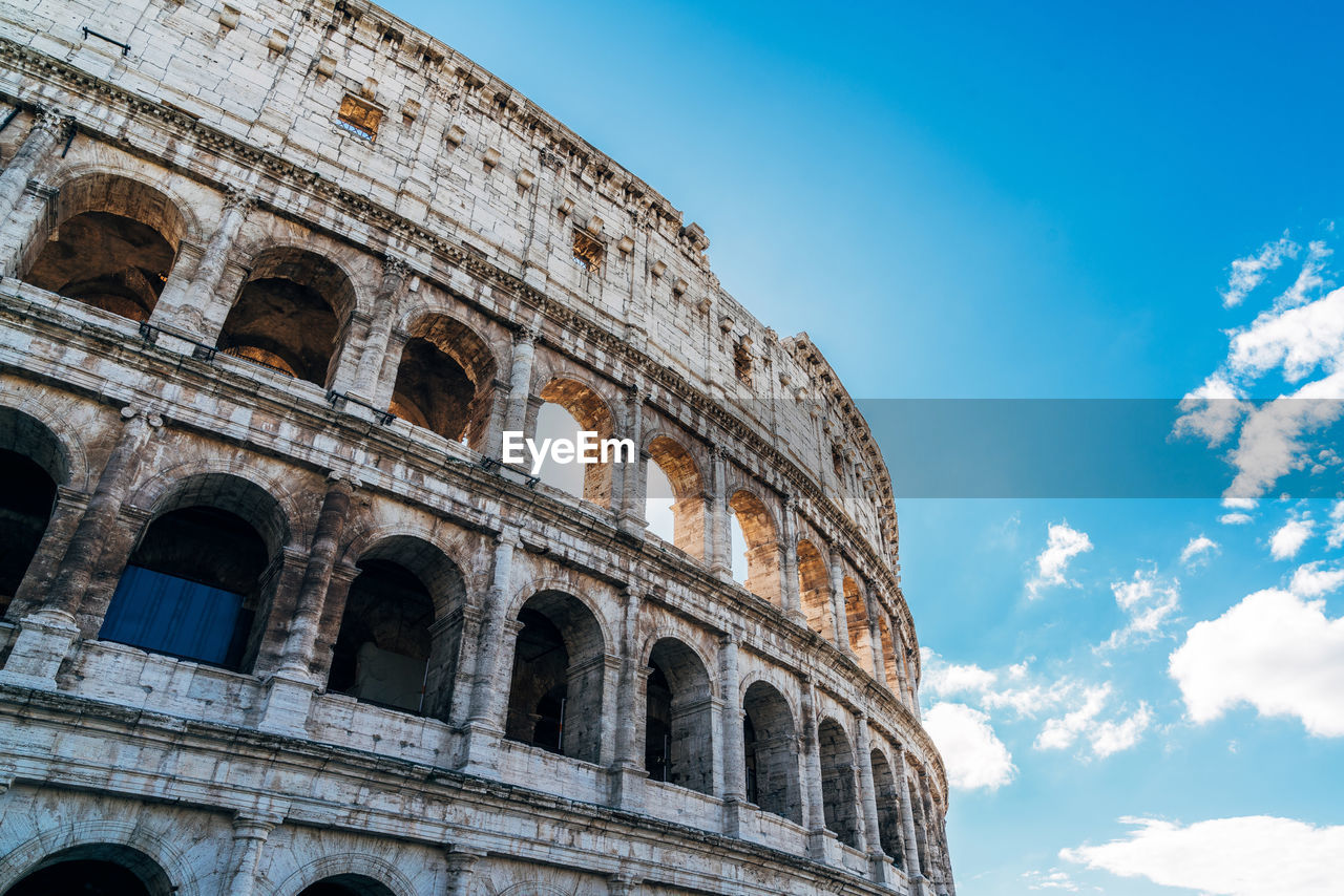 Low angle view of historical building against blue sky