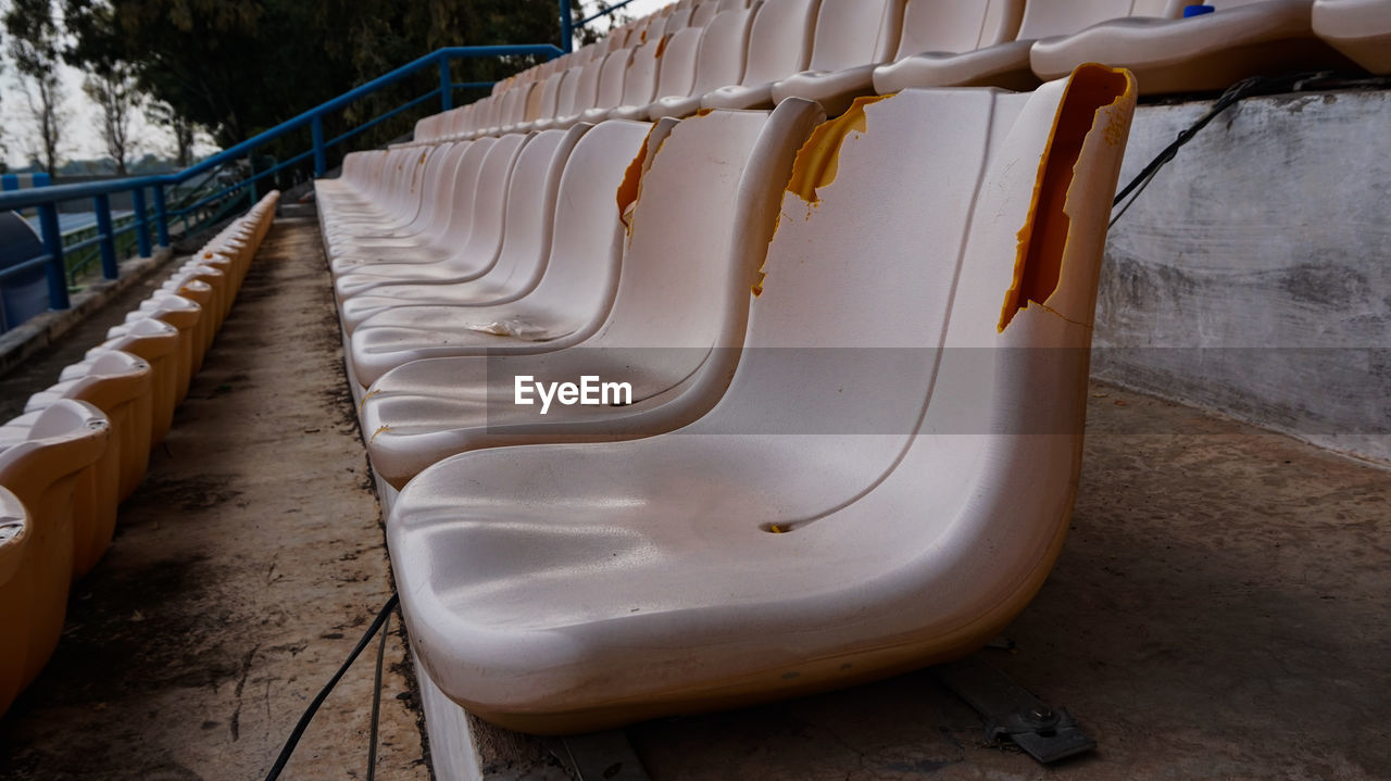 HIGH ANGLE VIEW OF EMPTY DECK CHAIRS