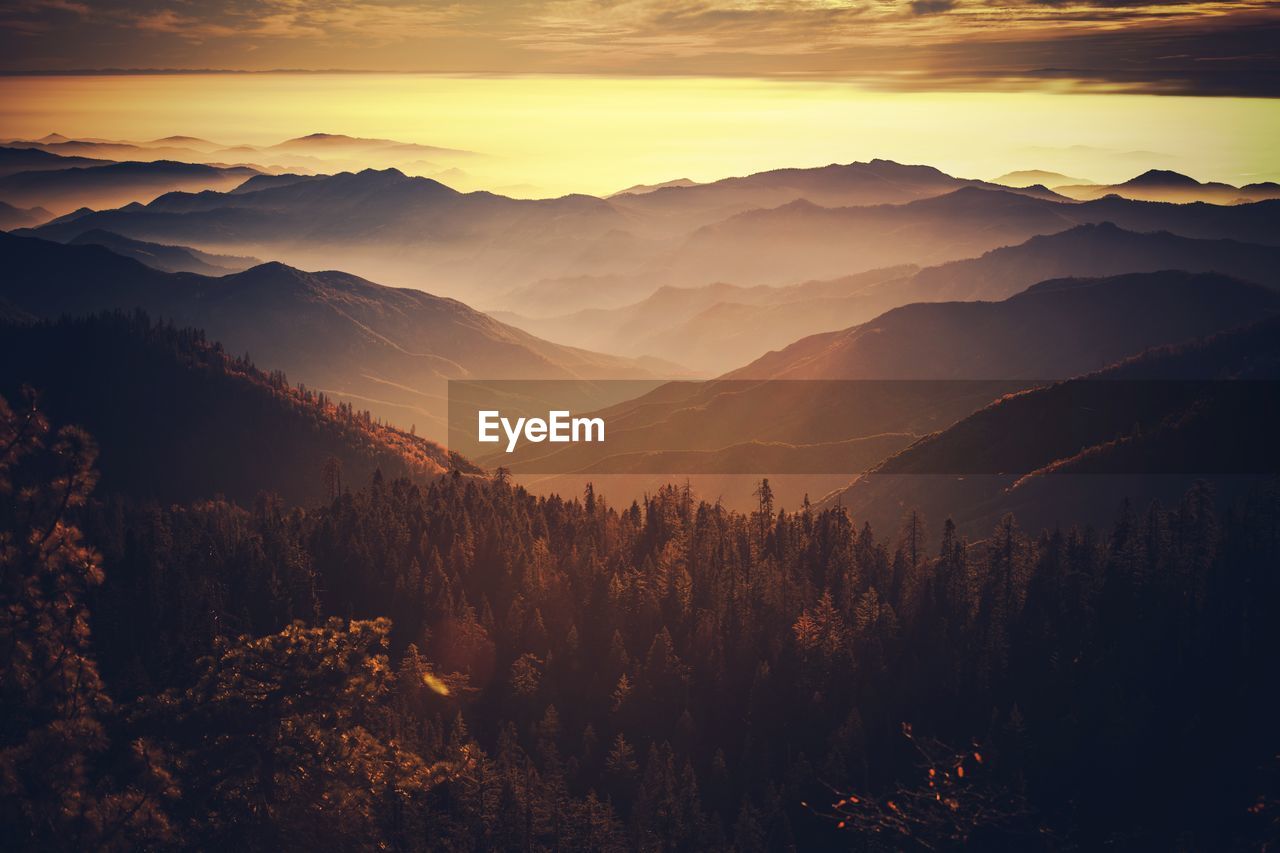 Scenic view of mountains against sky during sunset