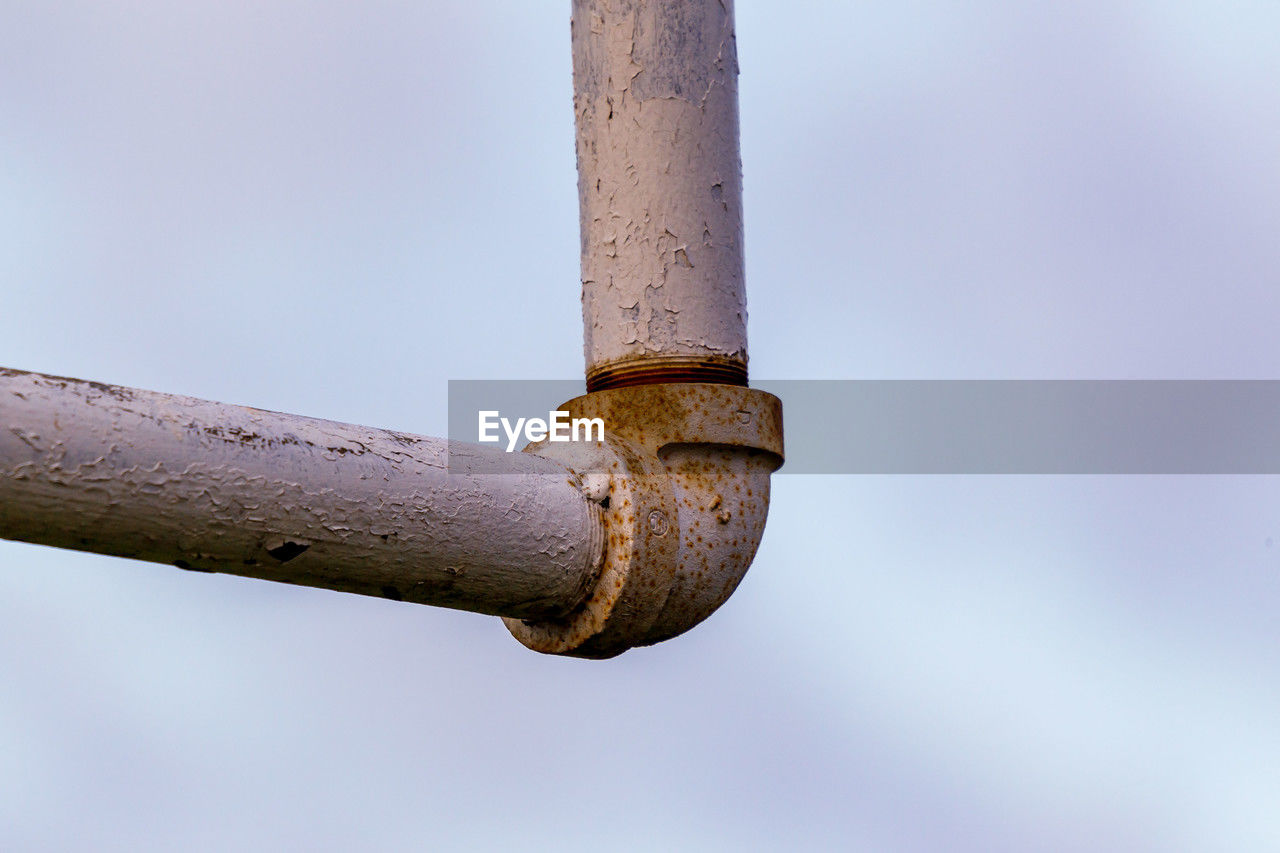 A close up of a football goal post that needs to be painted