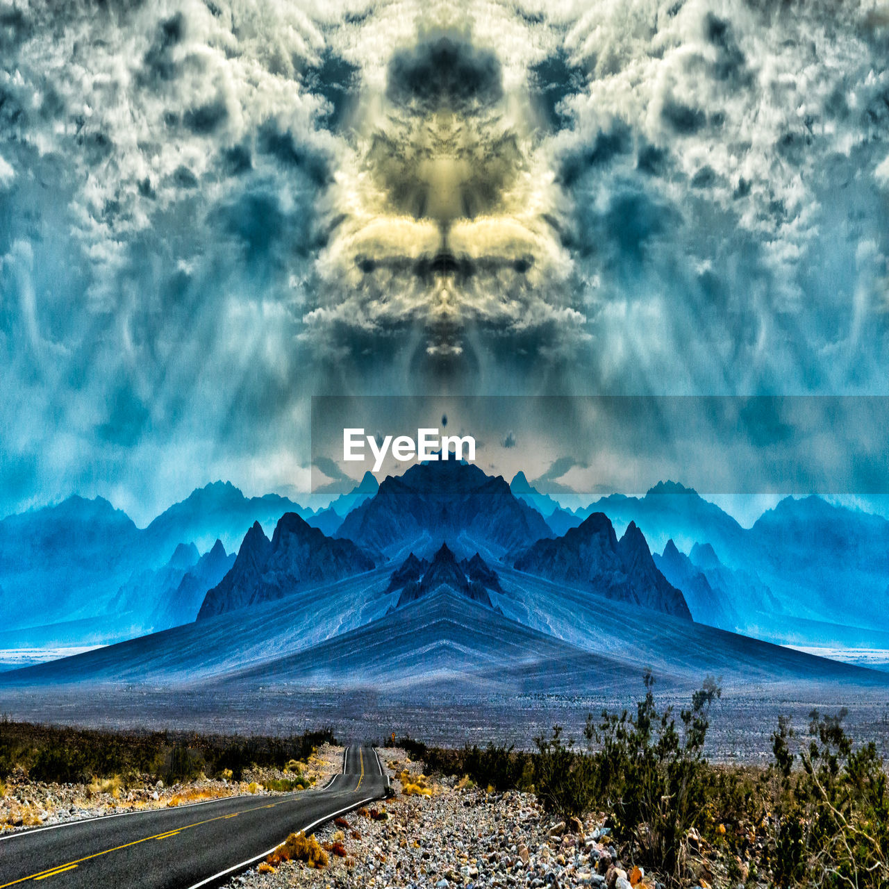 DIGITAL COMPOSITE IMAGE OF MOUNTAINS AGAINST SKY