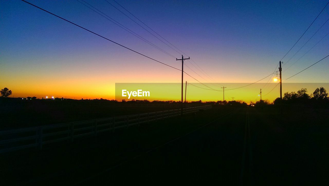 Silhouette landscape against sky during sunset