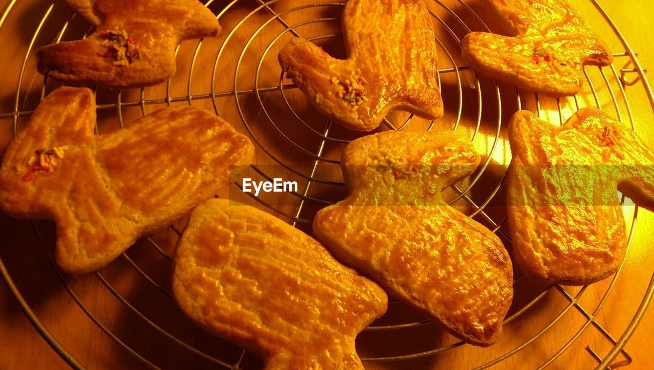 High angle view of cookies on metal grate