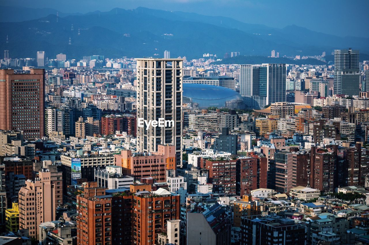 High angle view of modern buildings in taipei against sky