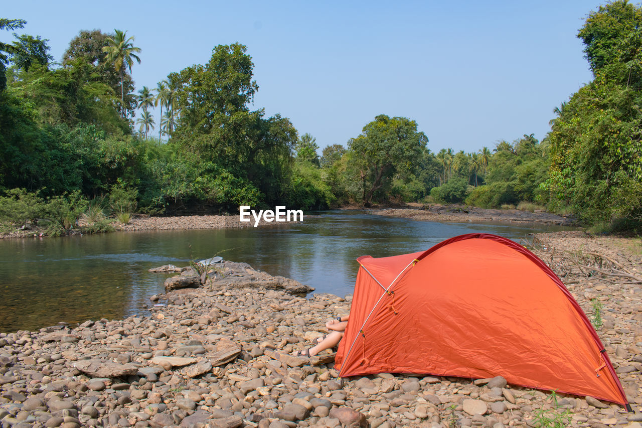 Tent in forest by the river side