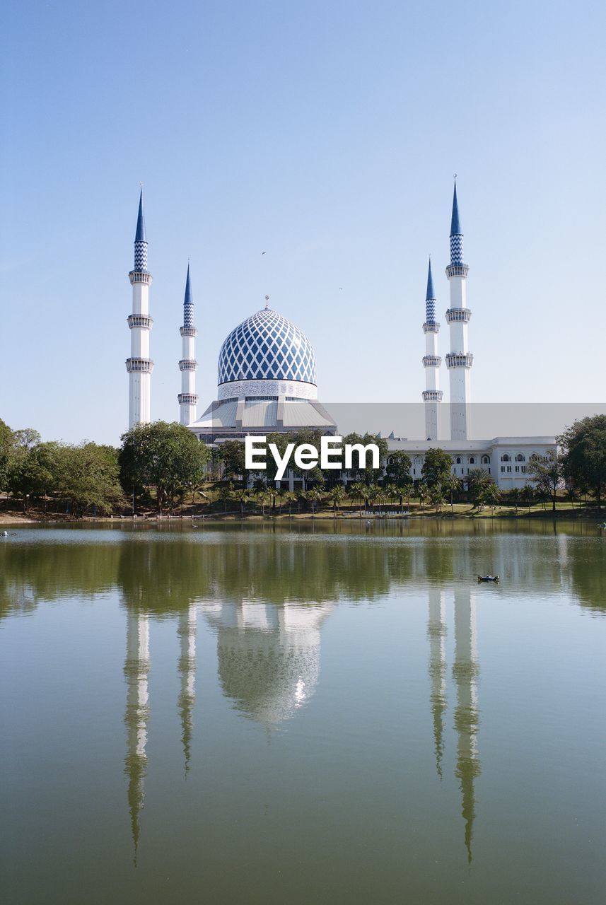 REFLECTION OF TEMPLE IN BUILDING