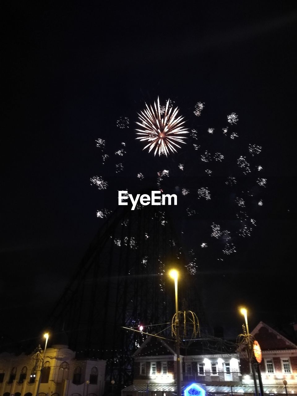 LOW ANGLE VIEW OF FIREWORKS AGAINST SKY AT NIGHT