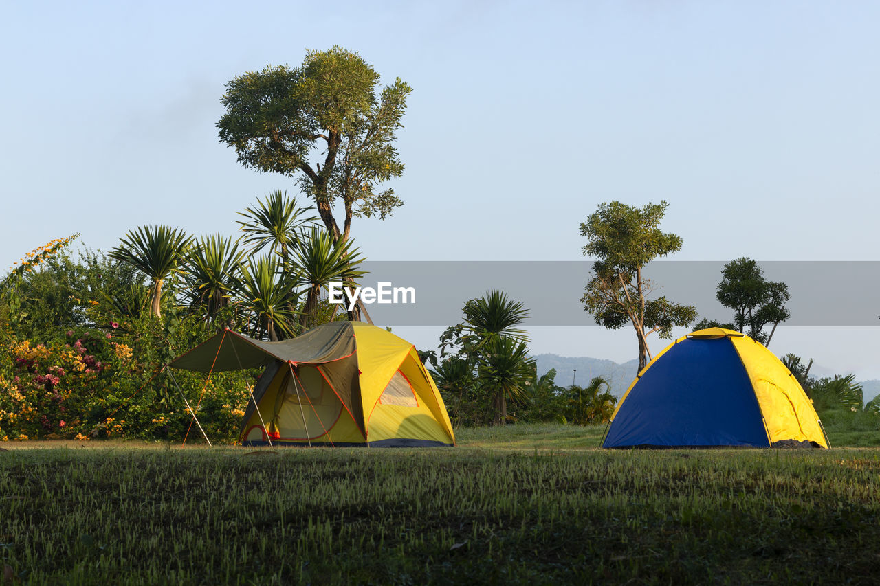 Tent on field against clear sky